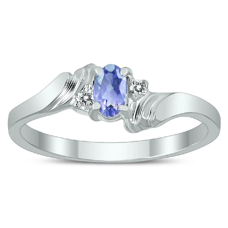 5X3MM Tanzanite and Diamond Wave Ring in 10K White Gold