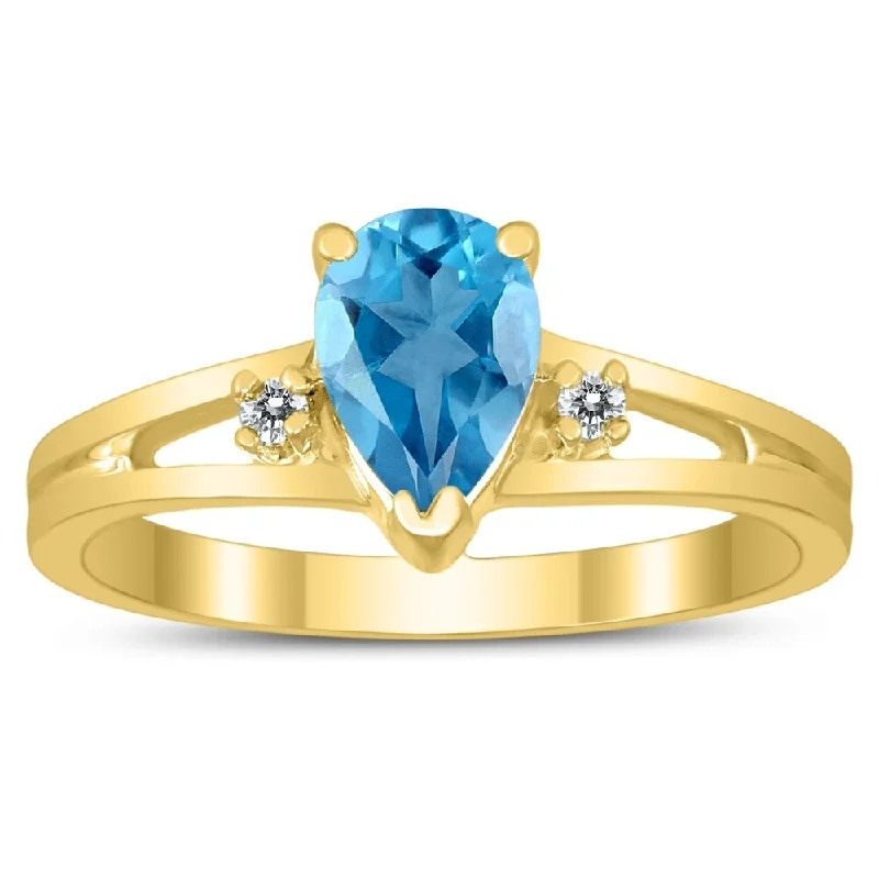 7X5MM Blue Topaz and Diamond Pear Shaped Open Three Stone Ring in 10K Yellow Gold