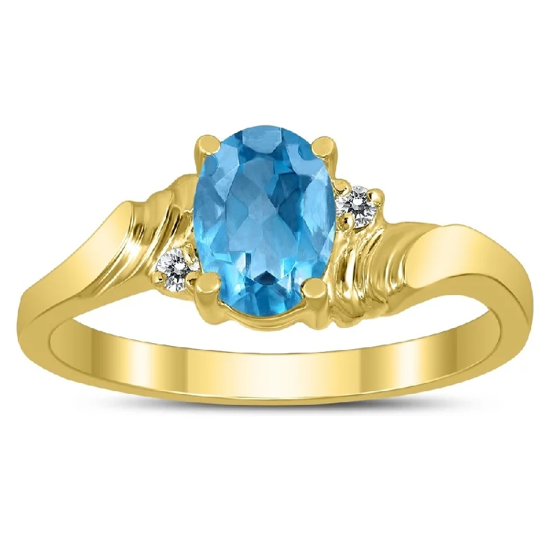 7X5MM Blue Topaz and Diamond Wave Ring in 10K Yellow Gold