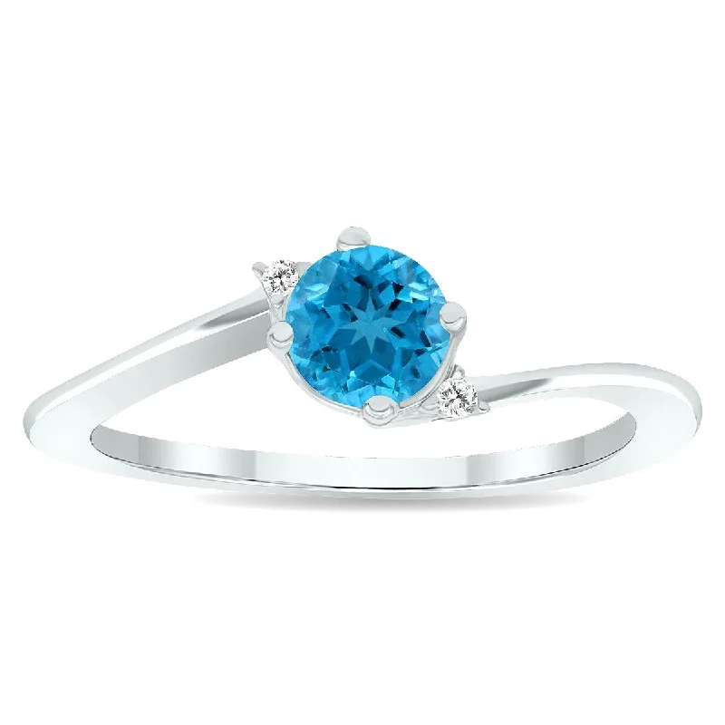 Women's Blue Topaz and Diamond Wave Ring in 10K White Gold